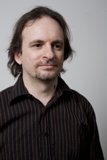 Long-Haired Man in Striped Shirt