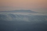 Fog Cascades Over the Hills at Twilight
