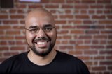 Smiling Bald Man in Glasses