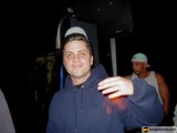 Man in Hoodie Enjoying His Drink