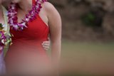 Two Women Embrace in Red Dresses