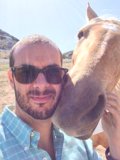 Man and Horse Under Blue Skies