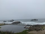Promontory Views Caption: A stunning view of the ocean from the grassy hill overlooking the coastline of Lands End, San Francisco, California.