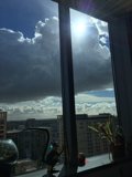 Loft Window Dramatic Clouds