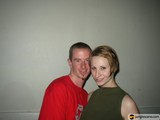 Smiling Couple in Front of Wall