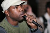 Steve J Performing with Green Shirt and Mic