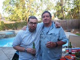 Two Friends Celebrating at a Backyard Pool Party