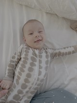 Smiling Baby in Polka Dot Sleepwear