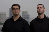 Two Happy Men in Black Shirts in the City