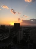 Sunset over the City Skyline from High Rise Building