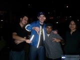 Four Men in Baseball Caps Under the Night Sky