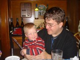 Father and Toddler Share a Joyful Restaurant Moment