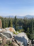 Serene Lake View from Rocky Hillside
