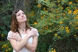 Woman Gazing Upward Among Yellow Wildflowers