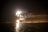 Fireworks Flare Over the Ocean