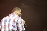 Plaid-Clad Performer Belts It Out