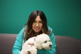 Happy Woman with White Canine Companion
