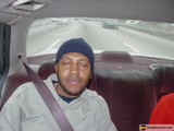 Two Men Riding in the Back Seat of a Car