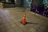 Urban Solitude: A Traffic Cone's Watch