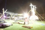 Parked Sports Car with Windmill in the Night Sky