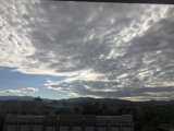 A Breathtaking View of Santa Fe's Skyscrapers with a Blue Sky and Cumulus Clouds