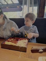 Young Boy Enjoying Japanese Bento Box Lunch