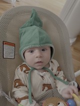 Adorable Baby in Green Elf Hat