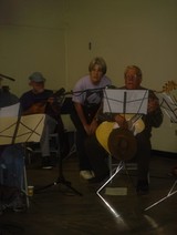 Group of Men Performing with Musical Instruments