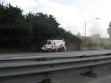 A Truck Making Its Way Down the Dusty Road