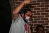 Man with Glasses enjoying a drink