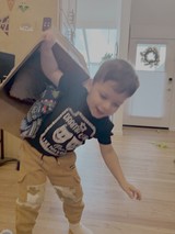 Child Playing and Stretching in Modern Home