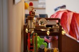 Festive Holiday Display on Wooden Cart with Toys