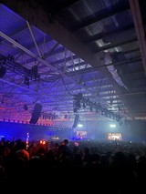 Electronic Music Festival with Dramatic Purple Stage Lighting