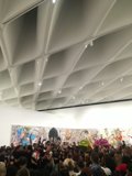 A Captivated Crowd in the Art Gallery