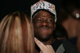 Smiling Man in Baseball Cap