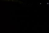 Silhouette of a Spider in the Urban Night