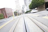 Streetscape with Train Track and Car in Metropolis