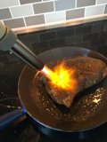 Sizzling Steak in Cooking Pan
