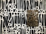 Collage of Symbols and Text on Wooden Frame
