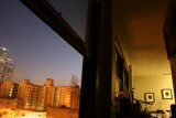A Cityscape From A High-Rise Window