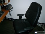 Black Office Chair with Phone and Computer