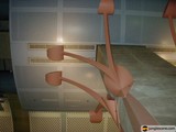 Metal Sculpture With Hanging Lamp