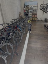 Child Explores Public Bikes + Gear Shop