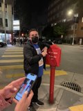 Urban Masked Man on His Phone