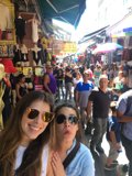 Stylish Women in a Busy Market