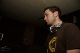 Musician in Brown Shirt and Headphones