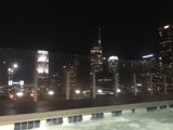 City Skyline at Night from Rooftop Pool