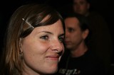 Smiling Woman with Hair Clip at Evening Event