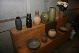 Myriad of Vases on a Wooden Shelf