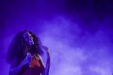 Solange Portrait Smiling Eyes Closed Head Back Blissful Purple